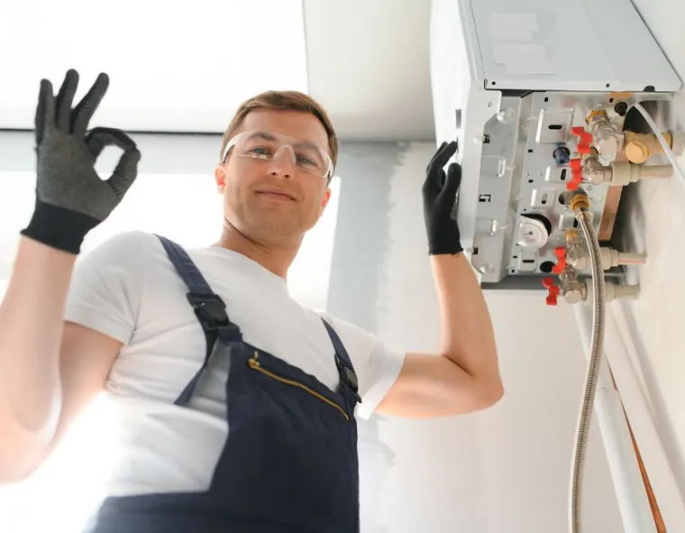 Technician confirming a completed water heater repair